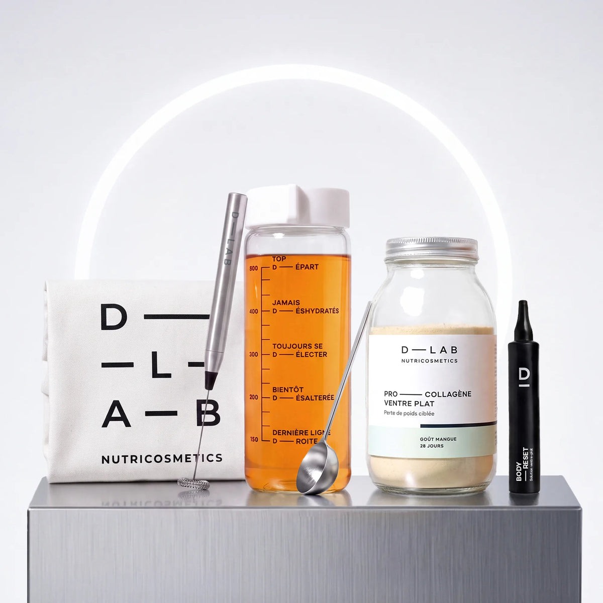 Routine Découverte Minceur D-LAB : flacon Boisson Minceur mangue, shot Body-Reset ventre plat, gourde en verre graduée, mousseur à lait, cuillère doseuse et tote-bag coton